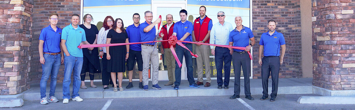 InfoWest staff and the Cedar City Chamber cutting the ribbon at the second Cedar City office