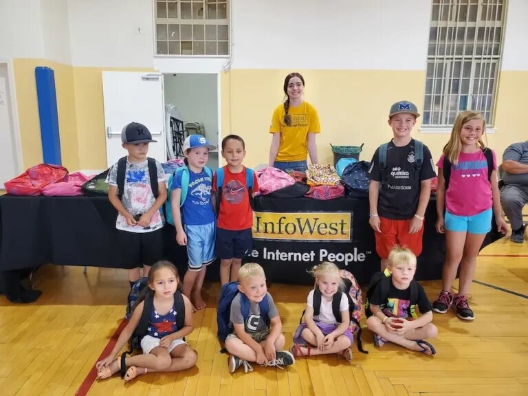 InfoWest team and families at the Overton backpack giveaway